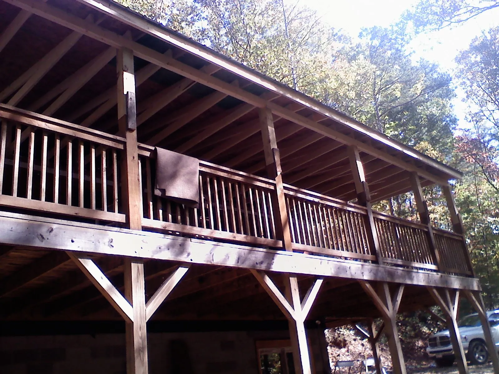 Timber framing under a new elevated porch and deck in Gray